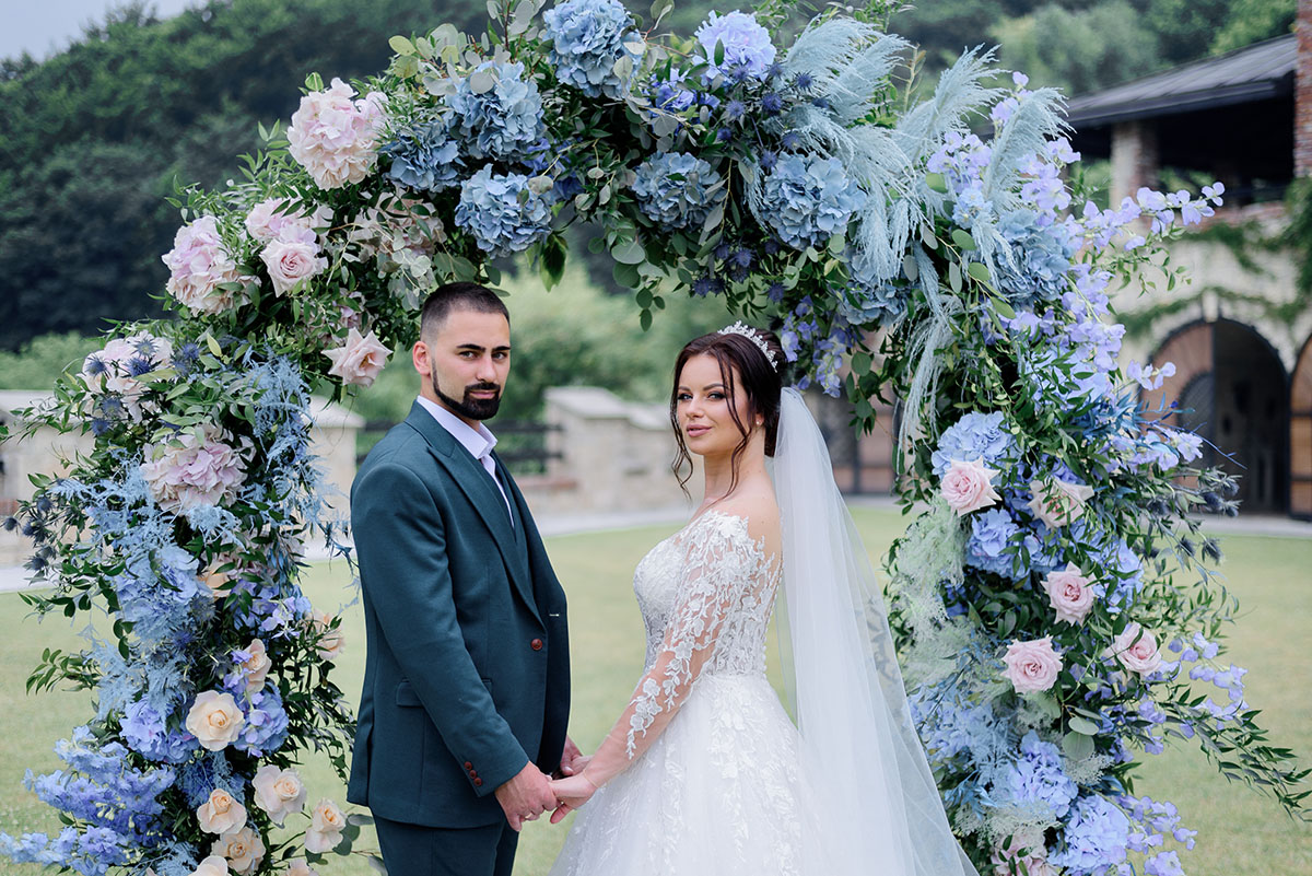Beautiful caucasian Wedding couple is standing in front of decor